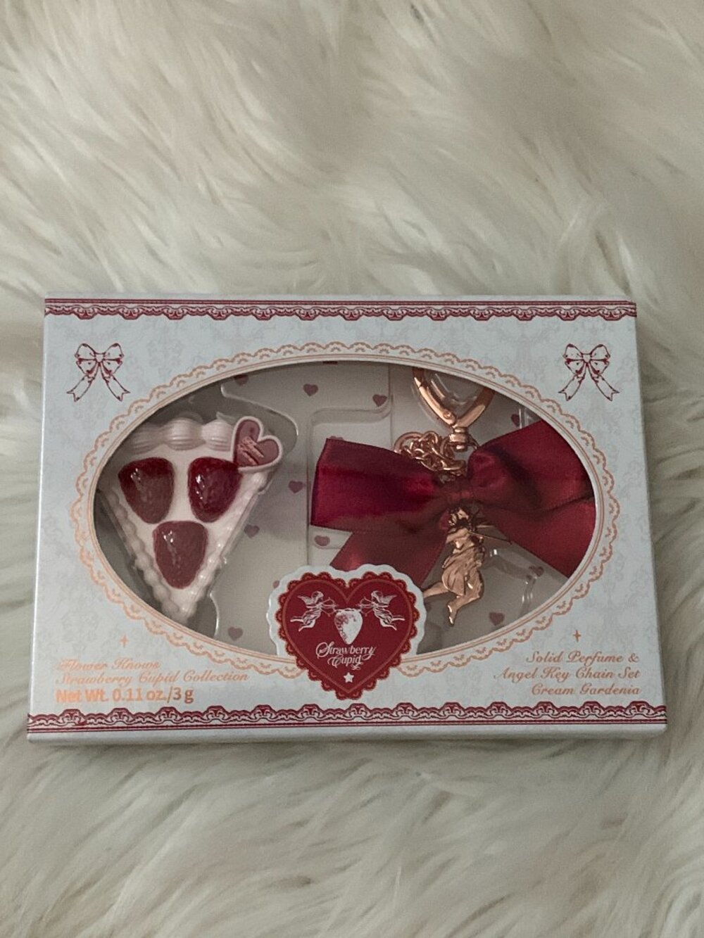 URBAN OUTFITTERS Flower Knows Strawberry Cupid Solid Perfume Key Ring